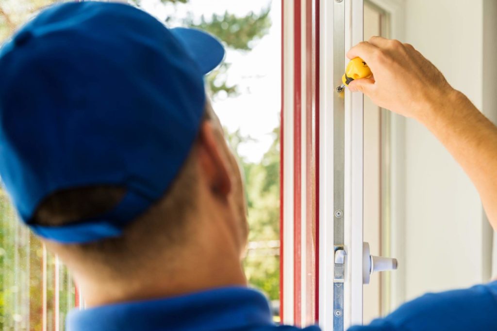 Worker installing a replacement window