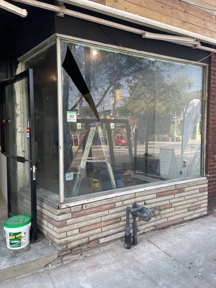 Commercial storefront window framing and replacement before